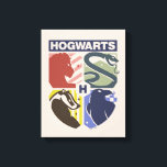 Vintage HOGWARTS™ Stamped Crest Canvas Print<br><div class="desc">Show your house pride in bold, vintage-inspired style with this striking Hogwarts™ crest design. Featuring graphic silhouettes representing the four iconic houses — Gryffindor™, Slytherin™, Hufflepuff™, and Ravenclaw™ — this artwork blends classic symbolism with a modern, retro aesthetic. Each house emblem is set within a clean, color-blocked shield, creating a...</div>