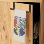 Vintage HOGWARTS™ Stamped Crest Tea Towel<br><div class="desc">Show your house pride in bold, vintage-inspired style with this striking Hogwarts™ crest design. Featuring graphic silhouettes representing the four iconic houses — Gryffindor™, Slytherin™, Hufflepuff™, and Ravenclaw™ — this artwork blends classic symbolism with a modern, retro aesthetic. Each house emblem is set within a clean, color-blocked shield, creating a...</div>