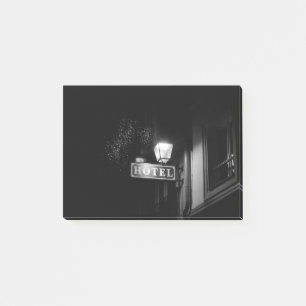 Vintage hotel sign, street light and many light post-it notes