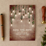 Vintage Lightbulbs Rustic Brick Botanical Wedding  Save The Date<br><div class="desc">Vintage Edison lights with botanical greenery hanging from top over weathered brick background.</div>