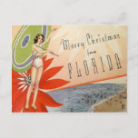 Vintage Merry Christmas from Florida beach girl Postcard<br><div class="desc">Vintage postcard reproduction Merry Christmas from Florida,  possible from the 1920s features a woman in a swimsuit with an umbrella,  a beach scene,  and a large red poinsettia flower. Fun Florida kitsch!</div>