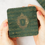Vintage Monogram Crest Music Manuscript Green Gold Coaster<br><div class="desc">This elegant vintage design features gold-coloured handwritten sheet music manuscript on a distressed dark emerald green and gold background. Personalise it with your monogram initial in Gothic font set off by an ornate antique gold crest frame.</div>