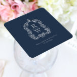 Vintage Monogram Crest Names Navy Blue Wedding Square Paper Coaster<br><div class="desc">This elegant design features an ornate,  regency vintage-inspired crest of acanthus leaves framing two monogram initials in open serif font,  stacked vertically and separated by a thin horizontal line. Add the couple's names and wedding date below. The design and text are in white on a navy blue background.</div>