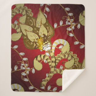 Vintage ornamental pattern on a red,  yellow and b sherpa blanket