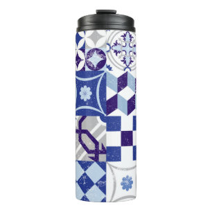 Vintage patchwork background with traditional blue thermal tumbler