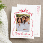 Vintage Red Bow Merry Christmas Photo<br><div class="desc">Celebrate the holiday season with this charming Christmas postcard featuring your family's photo framed by a festive red bow and ribbon on a crisp white background. "Merry Christmas" is elegantly written in a charming red handwritten script, with space to personalise your family name below. The back of the postcard displays...</div>