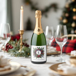 Vintage Rich Plaid Monogram Christmas Holiday Sparkling Wine Label<br><div class="desc">Add a festive and sophisticated touch to your holiday entertaining with this custom wine label, featuring a monogram nestled in a rich tartan wreath of pine, berries, and winter florals. Personalised with your family name or custom message, it's the perfect finishing detail for gifting bottles of wine, champagne, or sparkling...</div>