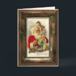 Vintage Santa Christmas Card<br><div class="desc">Charming and nostalgic image of Santa Claus busily preparing toys for Christmas. Inside is decorated with ornate filigree border. Keep suggested text or customise with your own. Matching address labels,  gift labels and postage available.
 Vintage frame graphic: studiocarilopez.com.</div>