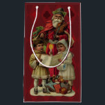 Vintage Santa Christmas Music Singing Small Gift Bag<br><div class="desc">Vintage Santa Claus Playing the Violin Santa Claus is having great fun in this reproduction of a vintage Christmas card. He's playing a violin as the two children in front of him are holding a candle, reading the sheet music, and singing along with a wonderful Christmas song. At their feet...</div>