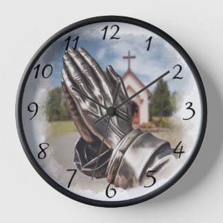 Vintage silver-looking Praying Hands with a Church Clock