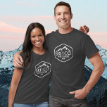 Vintage Ski Mountain Logo Aspen Colorado Your Text T-Shirt<br><div class="desc">This custom tshirt features a vintage rustic style logo with a snow covered ski mountain and rustic ski poles. Add your custom text - SKI CO, SKI VT, SKI CA, etc and your favourite ski mountain. There's also room for your name or initials. Great for wearing under your jacket on...</div>