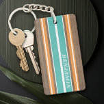 Vintage Surfboard Stripes - Subtle Wood Background<br><div class="desc">A colourful, retro stripe design in aqua blue and orange on a faux wood print background. A vintage surfboard stripe design with a beach and surf look. Add your name or monogram to make this a personal phone case that will stand out amongst your friends. The name is a thin...</div>