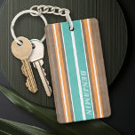 Vintage Surfboard Stripes - Subtle Wood Background Key Ring<br><div class="desc">A colourful, retro stripe design in aqua blue and orange on a faux wood print background. A vintage surfboard stripe design with a beach and surf look. Add your name or monogram to make this a personal phone case that will stand out amongst your friends. The name is a thin...</div>