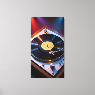 Vintage vinyl records spinning under colored light canvas print