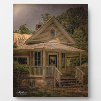 Vintage Wooden House With Porch on a Sunny Day Plaque