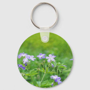 Violet flowers in the field key ring