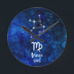 Virgo Zodiac Constellation Blue Galaxy Monogram Round Clock<br><div class="desc">Virgo Zodiac Constellation Blue Galaxy Monogram Design With trendy Brushed Script Font, Dark blue celestial watercolor background texture, Glowing star constellation, and The Maiden symbol. Modern Astrological Sign Birth Horoscope, is perfect for any Virgo Birthday From August 23 - September 22 ! With Optional Monogrammed First Middle and Last name...</div>