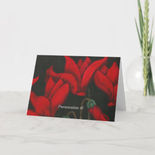 Vivid red Cyclamen blossom on dark black backgroun Card