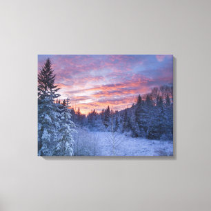 Vivid sunset paints the sky above wintery canvas print
