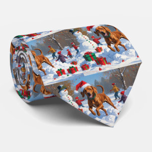 Vizsla Running in Snow with Christmas Hat Tie
