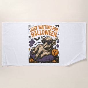 Waiting For Halloween Highland Cow Beach Towel