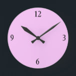 Wall Clock in Pink<br><div class="desc">This pink wall clock will look fabulous with more of the matching pillows,  serving trays,  picture frames and light switches in this store in the same bubble gum pink colour.</div>