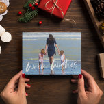 Warm Wishes Beach Family Photo Christmas Card<br><div class="desc">Christmas greeting card in a beach-inspired "warm wishes" photo design. Customised with your photo and your family's name. This beach Christmas card reverses to a blue and white nautical stripe design on the back.</div>