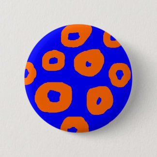 warped orange circles on blue background pins