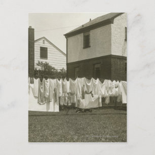 Washing line outside houses postcard