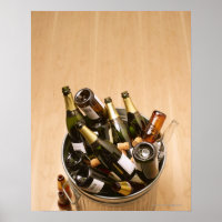 Waste bin full of empty champagne bottles on
