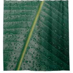 Water droplets on banana leaf shower curtain