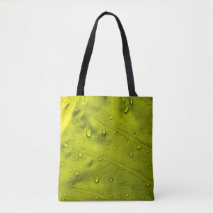 Water drops on green leaf tote bag