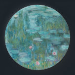 Water Lilies (by Claude Monet, 1915) Paper Plate<br><div class="desc">This design features a painting by French impressionist artist Claude Monet (1840–1926). It shows the an attractive arrangement of flowering water lilies on the pond at his home in Giverny, northern France. The lilies are painting in beautiful shades of turquoise and green. The original work was completed in 1915, and...</div>