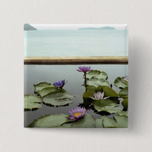 Water lilies in pond by ocean 15 cm square badge