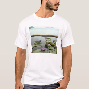 Water lilies in pond by ocean T-Shirt