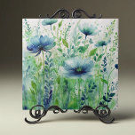 Watercolor Blue Flowers and Green Foliage Tile<br><div class="desc">Introducing our exquisite decorative ceramic tile. This stunning piece features a captivating watercolor design that brings the beauty of nature into your home. The artwork showcases a lush garden scene with delicate blue flowers and verdant green foliage, creating a serene and tranquil atmosphere. Each flower is meticulously detailed, with soft,...</div>