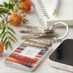 Watercolor Bookstack Reading Lover Monogram Key Ring<br><div class="desc">A charming book‑lover keychain featuring a colourful stack of illustrated book spines and a personalized monogram framed in a classic, literary style. Perfect for readers who want to carry a little piece of their bookish world wherever they go, this custom keychain adds warmth and personality to bags, keys, backpacks, and...</div>