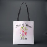 Watercolor Flowers Bouquet Maid of Honour Wedding Tote Bag<br><div class="desc">This pretty tote the perfect swag bag for thanking your maid of honour for her hard work making your wedding day special. It features a beautiful watercolor bouquet of wildflowers, pansies, or violets on a pale pink background. The caption across the top reads: Maid of Honour, and there is space...</div>