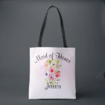 Watercolor Flowers Bouquet Maid of Honour Wedding Tote Bag<br><div class="desc">This pretty tote the perfect swag bag for thanking your maid of honour for her hard work making your wedding day special. It features a beautiful watercolor bouquet of wildflowers, pansies, or violets on a pale pink background. The caption across the top reads: Maid of Honour, and there is space...</div>