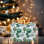 Watercolor Green Gold Glitter Christmas Ornaments  Wrapping Paper<br><div class="desc">Festive Christmas holiday wrapping paper featuring a watercolor pattern of beautiful Christmas ornaments. Shiny green ornaments with gold patterns. White ornaments with a pattern of holly and gold glitter,  small green and white ornaments and holly scattered throughout pattern.</div>