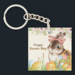 Watercolor Happy Easter Day Floral Bunny with Bow Key Ring<br><div class="desc">Celebrate the joy of Easter with this elegant watercolor illustration — a sweet brown-and-white bunny wearing a soft pink bow, nestled among vibrantly painted eggs in a woven basket, all framed by delicate pink peonies, greenery, and wildflowers. The warm, hand-painted aesthetic evokes vintage charm and heartfelt sincerity. Includes the tender...</div>