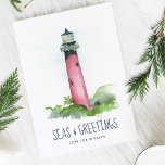 Watercolor Lighthouse Florida Beach Christmas Holiday Card<br><div class="desc">This Coastal theme Christmas card features my original hand painted watercolor Jupiter, Florida lighthouse in shades of red on a crisp white background. The words Seas and Greetings are set in a modern brush script typography in navy blue. The inside features a solid blue colour with your custom greeting in...</div>