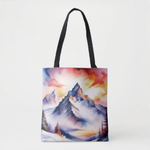 Watercolor of snow covered mountains under red sky tote bag