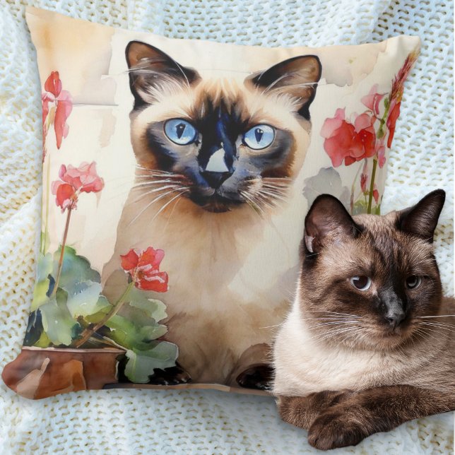 Watercolor Siamese Cat with Red Geranium Flowers Cushion (A pillow cushion with illustration of a Siamese cat with red geraniums in a watercolor style)