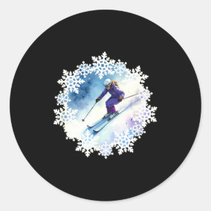 Watercolor snowflakes and skier classic round sticker