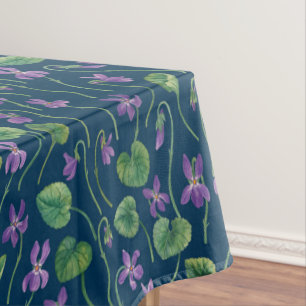 Watercolor violets on blue tablecloth