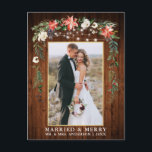 Watercolor Winter Floral Wood Gold Married Merry Postcard<br><div class="desc">Rustic Wood Elegant Watercolor Winter Floral Wood Newlywed Photo Married & Merry Christmas Postcard includes beautiful watercolor red poinsettias,  botanical greenery,  winter foliage,  holly berries,  white roses,  cotton,  pine cones and blue berries.  Rustic Country Wood and String Lights. Gold Frame.</div>