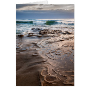 Wave breaking on beach, California