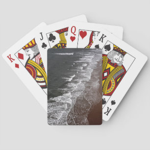 Waves breaking on a sandy beach playing cards