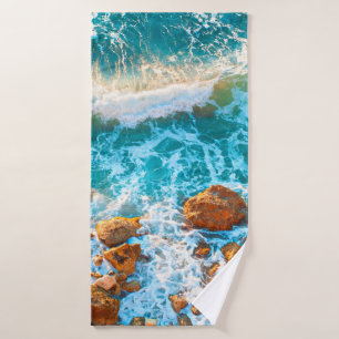 Waves on a rocky beach at sunset. Aerial viewbeach Bath Towel